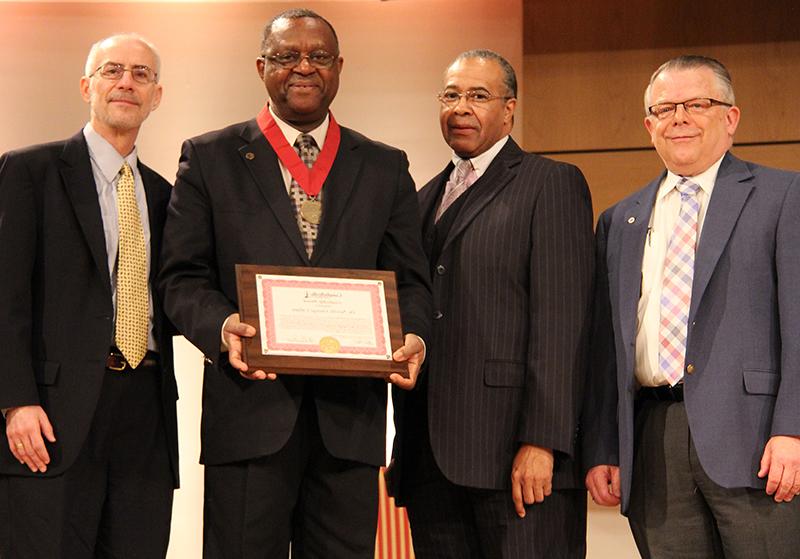  During the service, Dr. Neville Geroge Callam was presented a Servant Leadership Award. From left: Dr. John Chowning, vice president for church and external relations and executive assistant to the president, Dr. Joe Owns, chairman of the Board of Trustees, Callam, and Dr. John Hurtgen, dean of the School of Theology. (Campbellsville University Photo by Rachel DeCoursey)