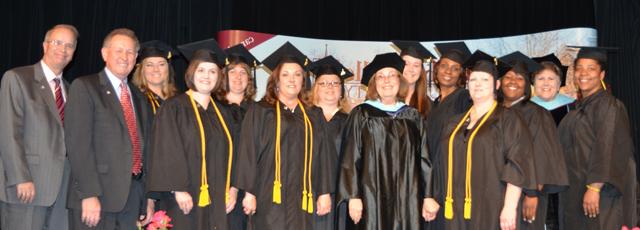 Campbellsville University education students, from left, in the interdisciplinary early childhood education program from left are: Front row -- From left: Debra Brady, Dr. Sharon Hundley, Donna White, Denise Spencer, Dr. Frank Cheatham and Dr. Michael V. Carter. Back row -Gwen Atkinson-Sample, Dr. Brenda Priddy, Kristina Fletcher, Sharon Fragier, Tara Johnson, Rhonda Maggard, Betty Roark and Katie Robb. (Campbellsville University Photo by Joan C. McKinney)