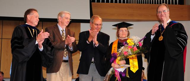 Linda J. Cundiff, second from left, receives the Excellence in Teaching Award at Campbellsville University from the CU Advancement Board. From left are: Dr. Michael V. Carter, president; Cundiff; Kimble Jessie, Advancement Board member; Randy Herron, Advancement Board chair; and Dr. Frank Cheatham, vice president for academic affairs. (Campbellsville University Photo by Ashley Wilson) 