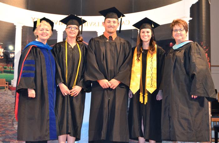 Students pinned during Campbellsville University's School of Education Pinning Ceremony include from left: Susan Blevins, assistant professor of education; Casey Hunt of Mt. Vernon, Ky.; Matthew Johns of Campbellsville, Ky.; Kelly Thomas of Russell Springs, Ky; and Dr. Beverly Ennis, dean of the School of Education. (Campbellsville University Photo by Jordan Snider)