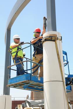 Dustin Benningfield, left, and Gary  Mattingly, supervisor, with Haydon  Steel build the colonnade for Alumni & Friends Park. (Campbellsville University Photo by Drew Tucker)