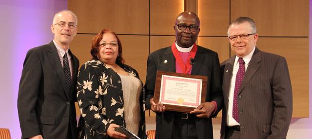 Bishop Charles J. King Jr., second from left, receives the Campbellsville University Leadership Award from Dr. John Chowning, vice president for church and external relations and executive assistant to the president, at chapel. The Rev. Pamela Buford, co-pastor of Fannie Chapel CME Church, and Dr. John Hurtgen, dean of the School of Theology at Campbellsville University,  also participated. (Campbellsville University Photo by Rachel DeCoursey)