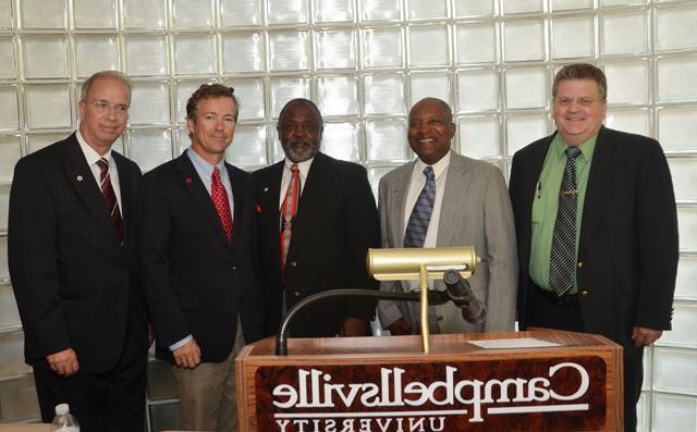 Leaders of the Taylor County Ministerial Association pose with United States Sen. Rand Paul (R-Ky.), fourth from left, and Dr. Michael V. Carter, president of Campbellsville University, far right. From left are: the Rev. Michael Goodwin, vice president of the TCMA; the Rev. Michael Caldwell, president; and the Rev. James Washington, secretary. (Campbellsville University Photo by Joan C. McKinney) 