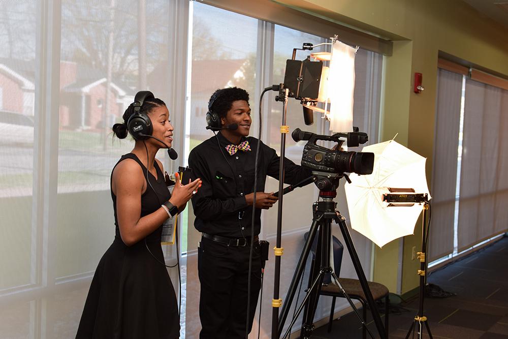 From left, Lionel Jones and Lexxus Graham, work on cameras for the 9th Annual Derby Rose Gala at Campbellsville University. (Campbellsville University Photo by Joshua Williams)