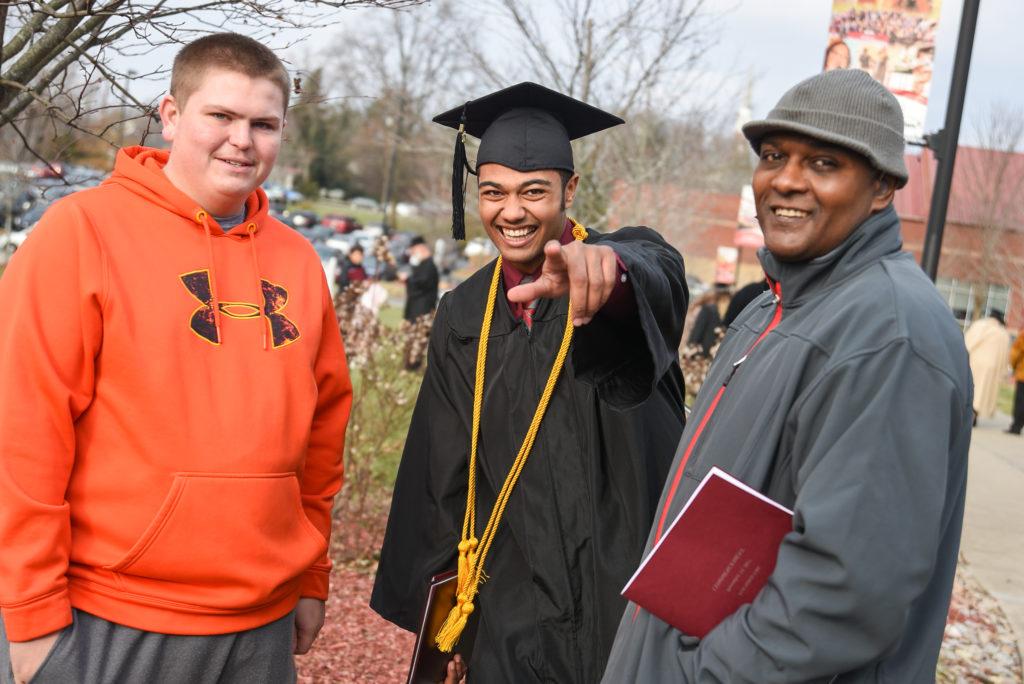 From left, Francis Thurman and Cory Ater, third from left, enjoy a commencement moment with Christian Thurman of Elizabethtown, Ky. (Campbellsville University Photo by Joshua Williams)