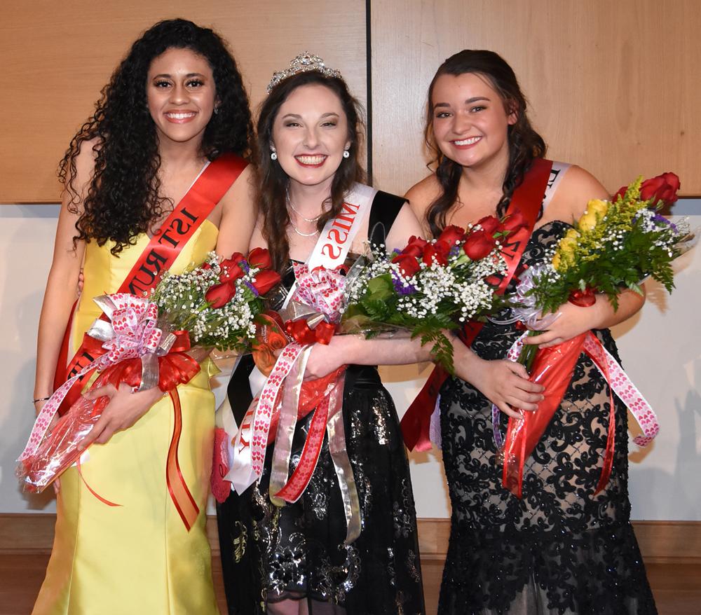 Winners in the annual Valentine Pageant tonight at Campbellsville University were Cassie Emery, center, Queen; Maiya Henderson, right, first runner-up, and Rebekah Mobley, left, second runner-up. Emery represented Baptist Campus Ministry and is a junior from Cloverport, Ky. Henderson is a freshman from Bowling Green, Ky., and she represented the Black Student Association. Mobley is a sophomore from Elizabeth- town, representing the Office of Enrollment Services. Emery will represent Campbellsville University in the annual Kentucky Mountain Laurel Festival in Pineville, Ky., May 24-27. (Campbellsville University Photo by Ariel Emberton)